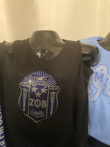 Black shirt cut out sleeves with shield